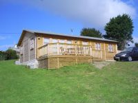 40 x 20 Log Cabin with garden office doors & windows. Customer lined building for holiday letting. 